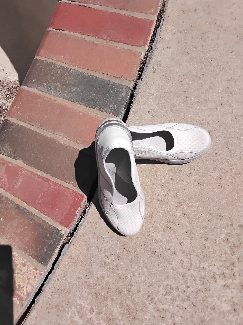 Bzees White Slip-On Athletic Shoes with Black Insole Accent